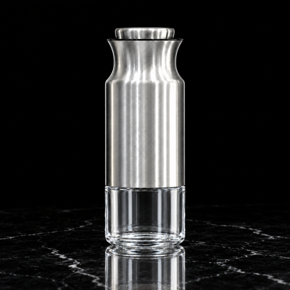 Steel and glass storage jar on black marble