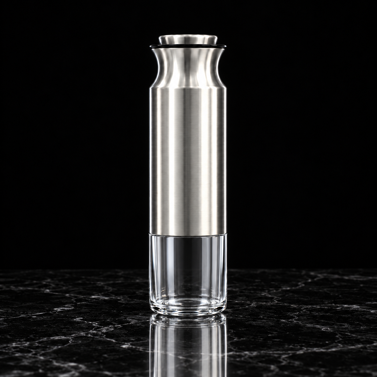 Steel and glass storage jar on black marble