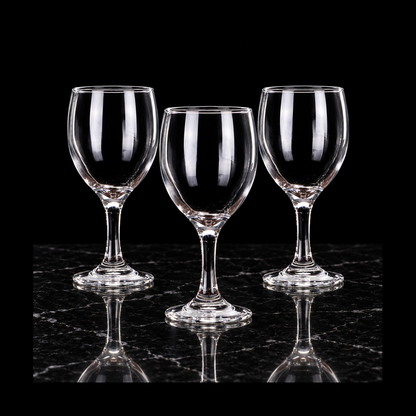 Clear wine goblets on black marble