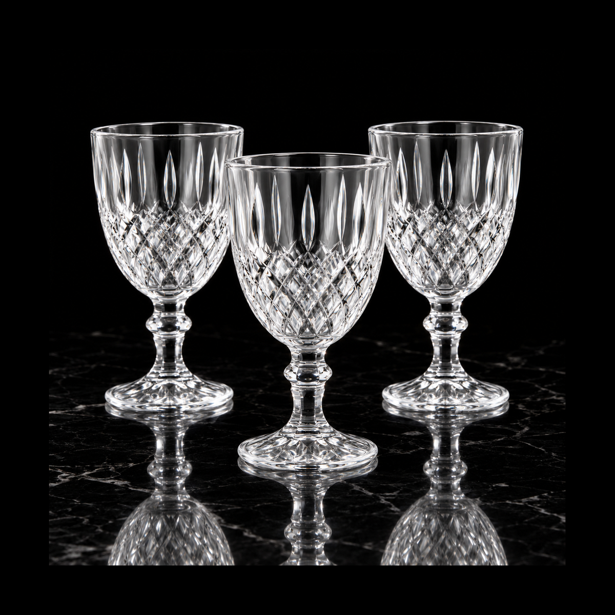 Cut crystal goblets on black marble
