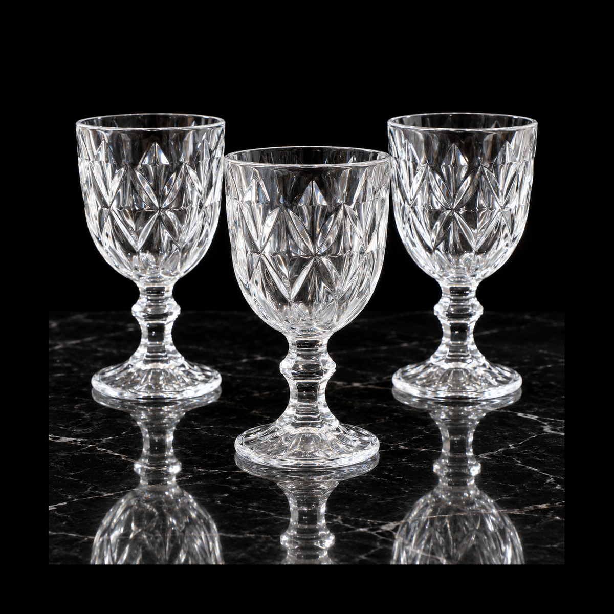 Cut crystal goblets on black marble