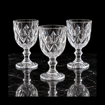 Cut crystal goblets on black marble