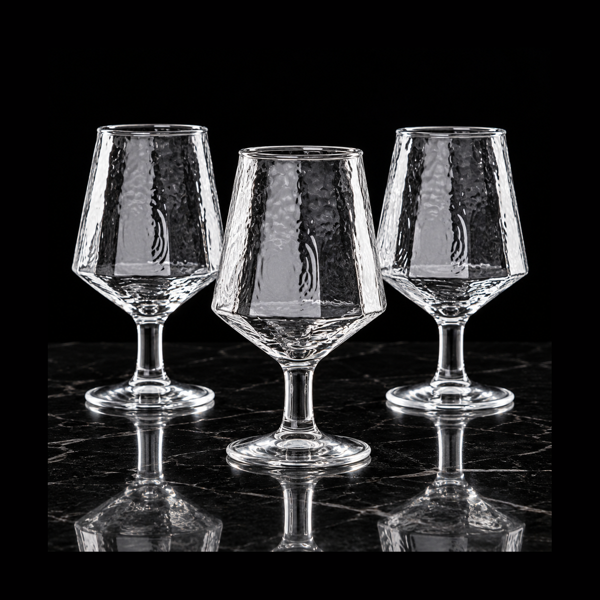 Hammered goblets on black marble