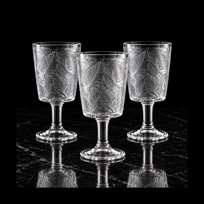 Glass goblets on black marble