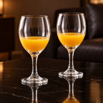 Wine goblets with mango juice in a living room