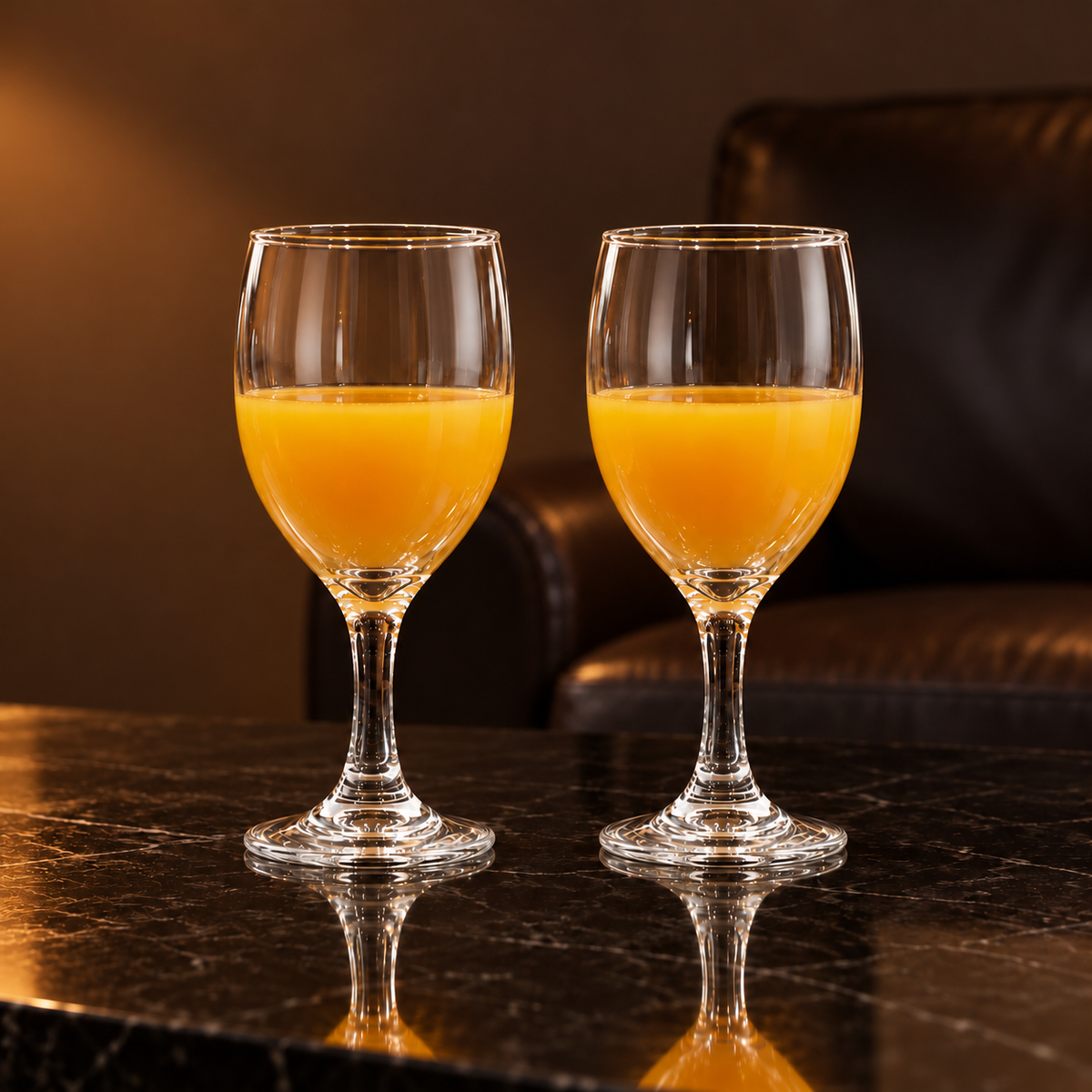 Goblets with mango juice in a living room
