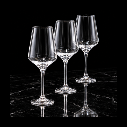 Clear tulip glasses on black marble