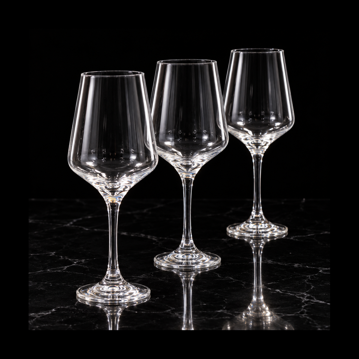 Large tulip glasses on black marble