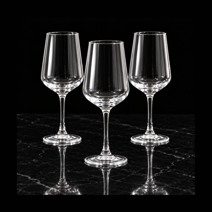 Clear wine glasses on black marble