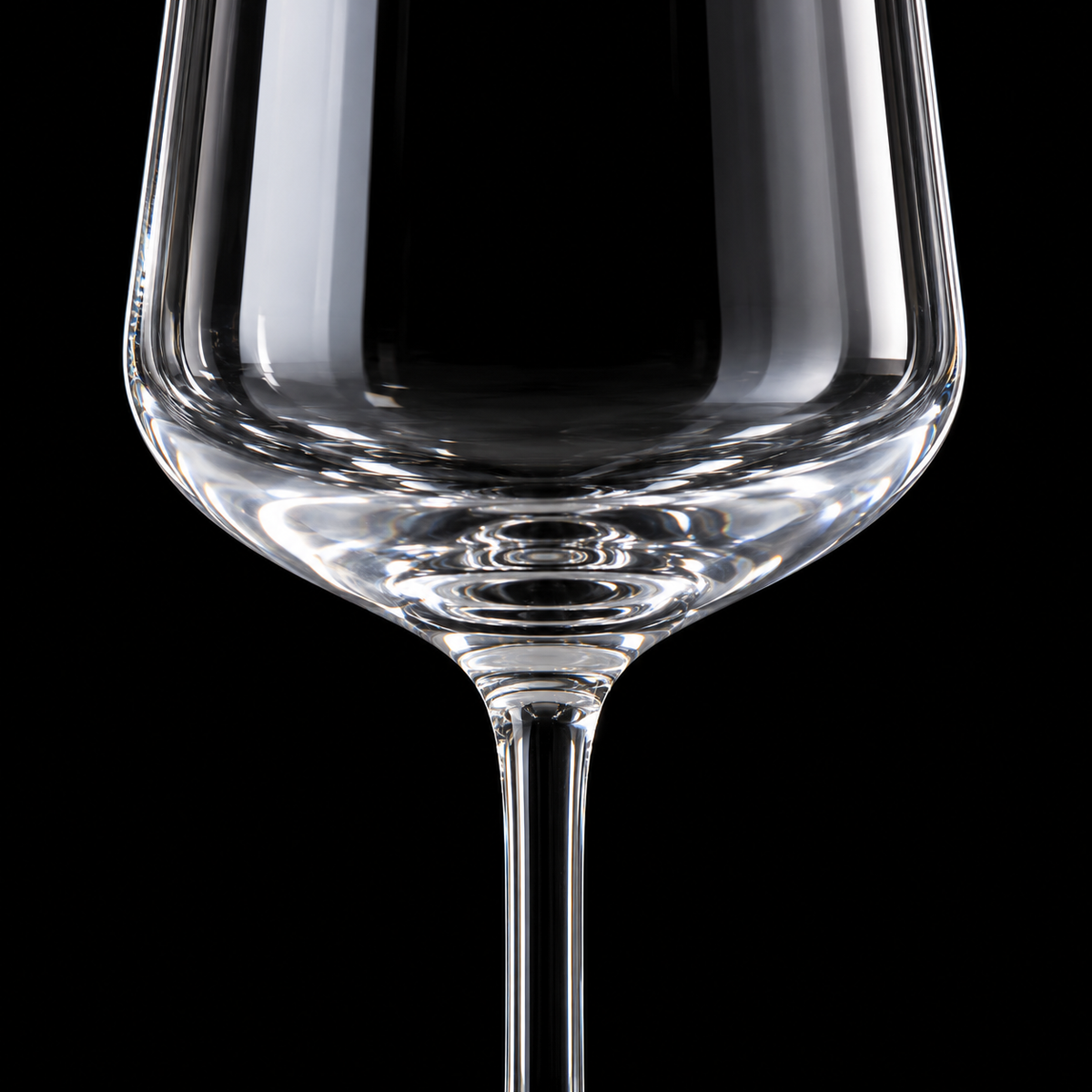 Close-up of wine glass bowl and stem