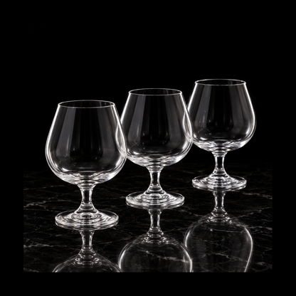 Crystal snifters on black marble