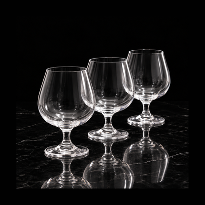Crystal snifters on black marble