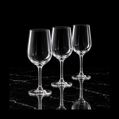 Small crystal wine glasses on black marble