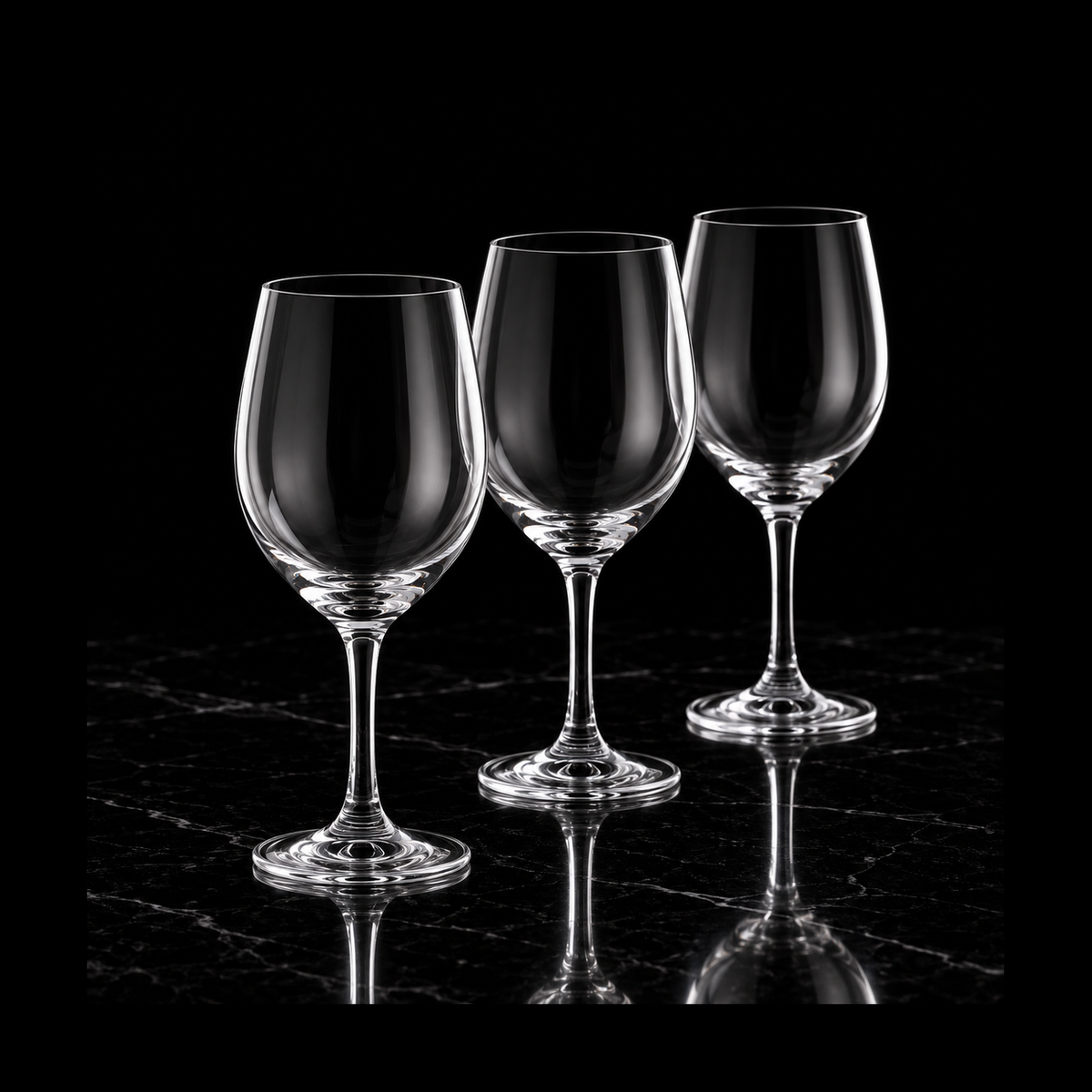 Crystal wine glasses on black marble
