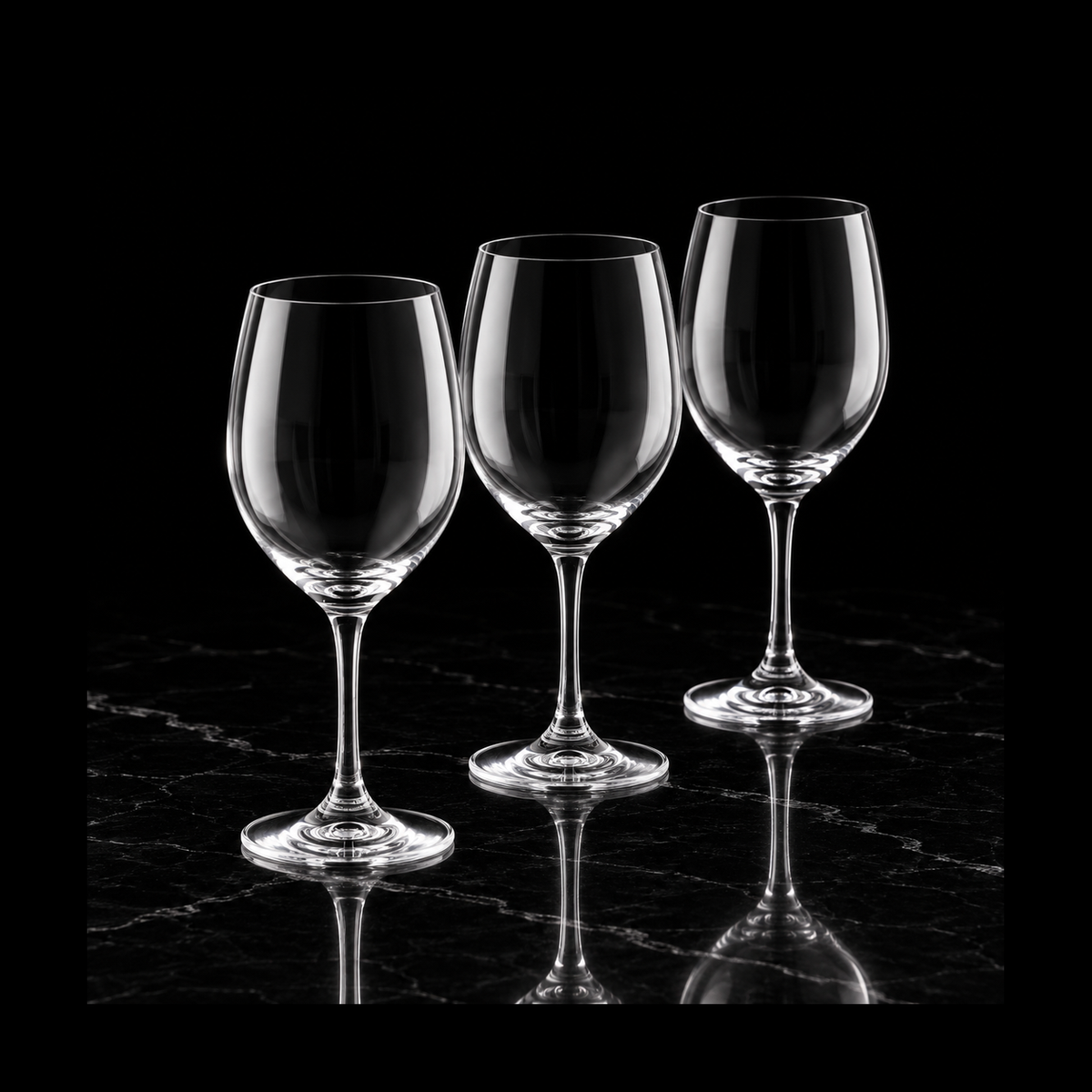 Crystal wine glasses on black marble