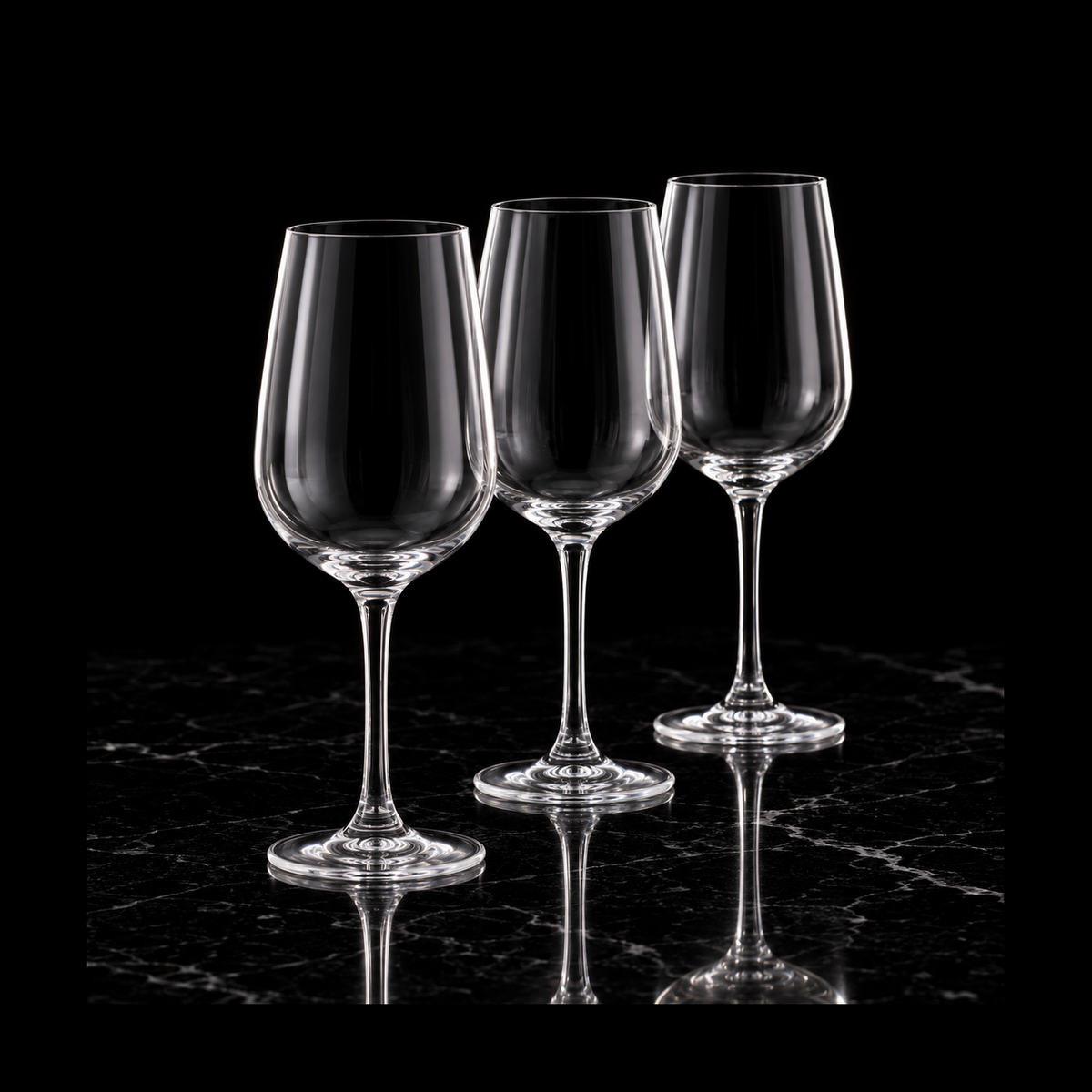Crystal wine glasses on black marble
