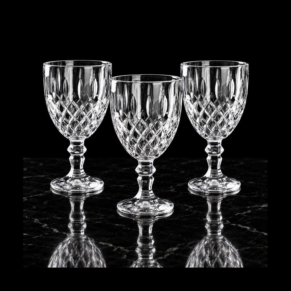 Cut crystal goblets on black marble