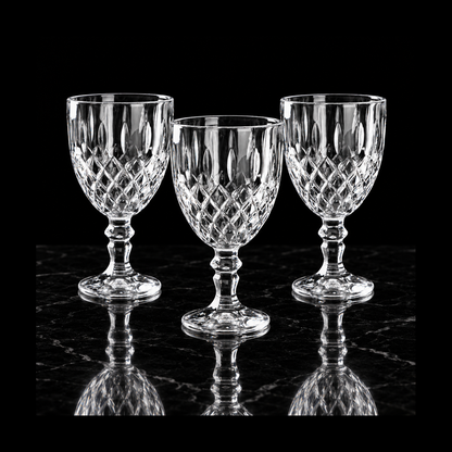 Cut crystal goblets on black marble
