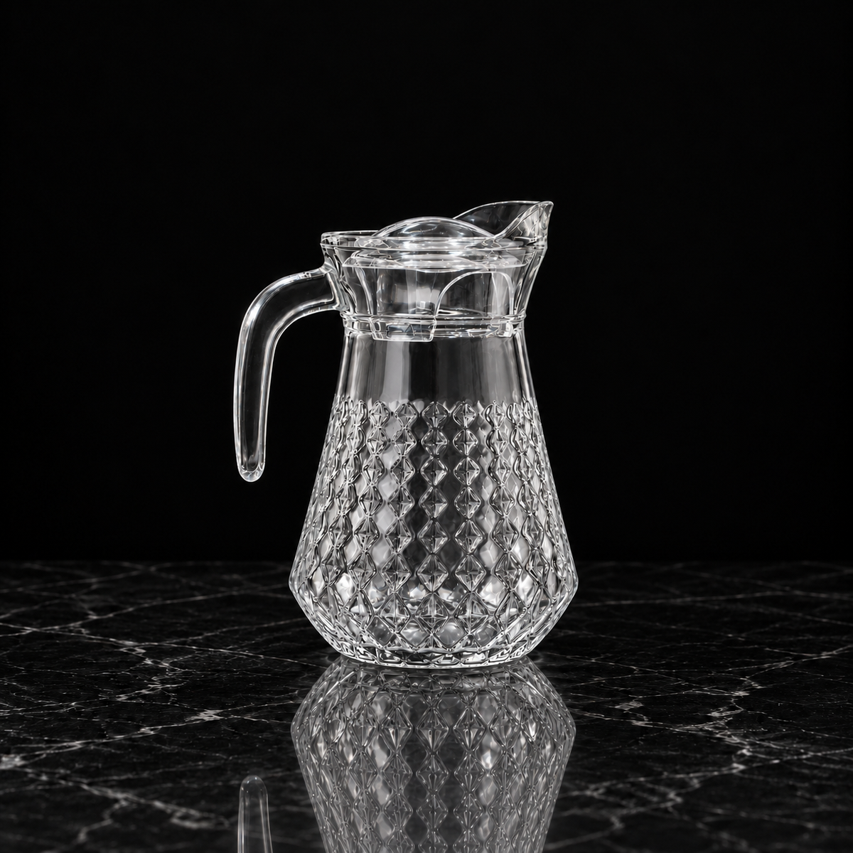 Glass jug on black marble