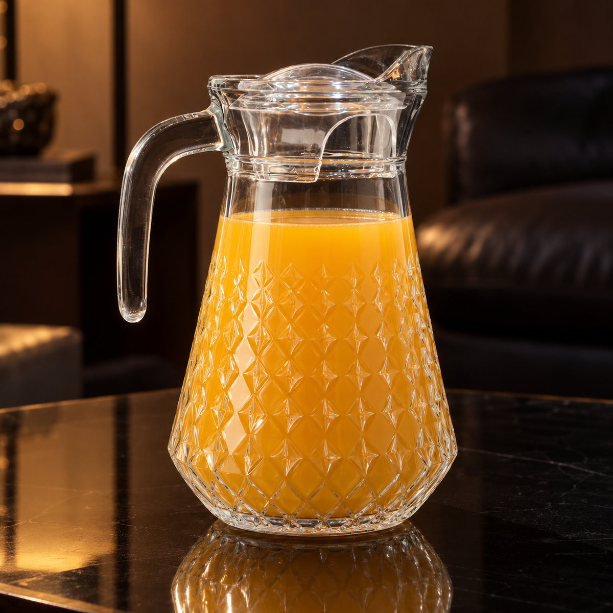 Glass jug with orange juice in living room