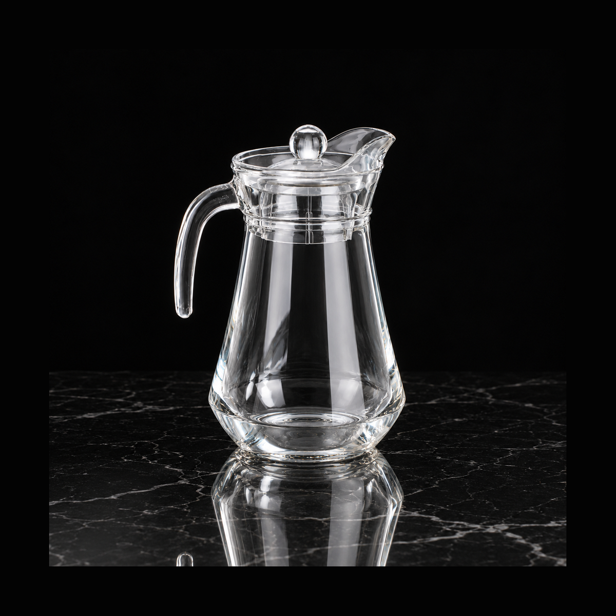 Glass jug on black marble