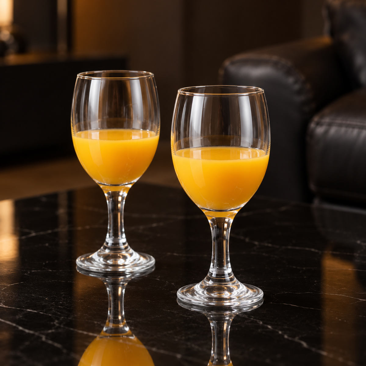 Wine goblets with mango juice in a living room