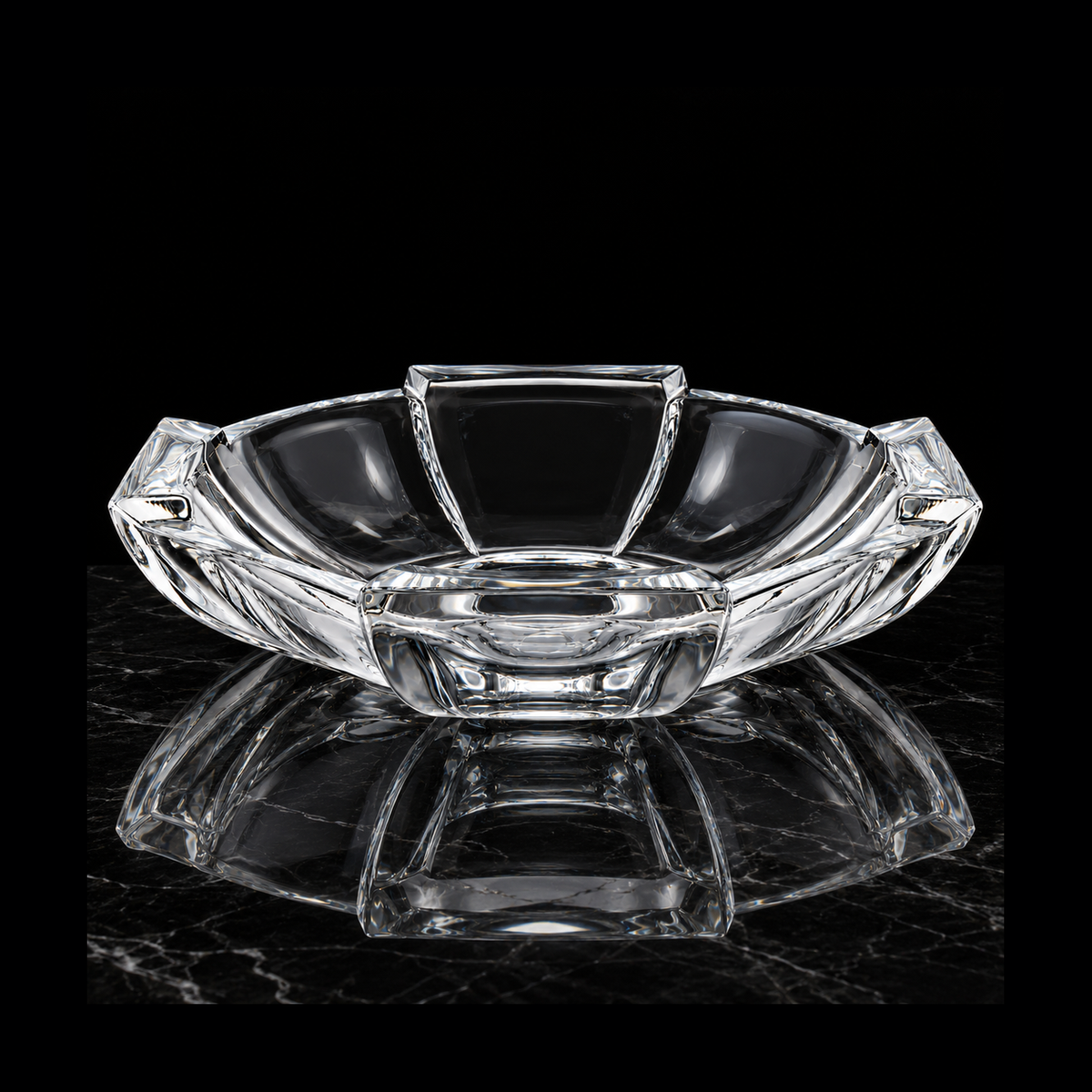 Crystal fruit bowl on black marble