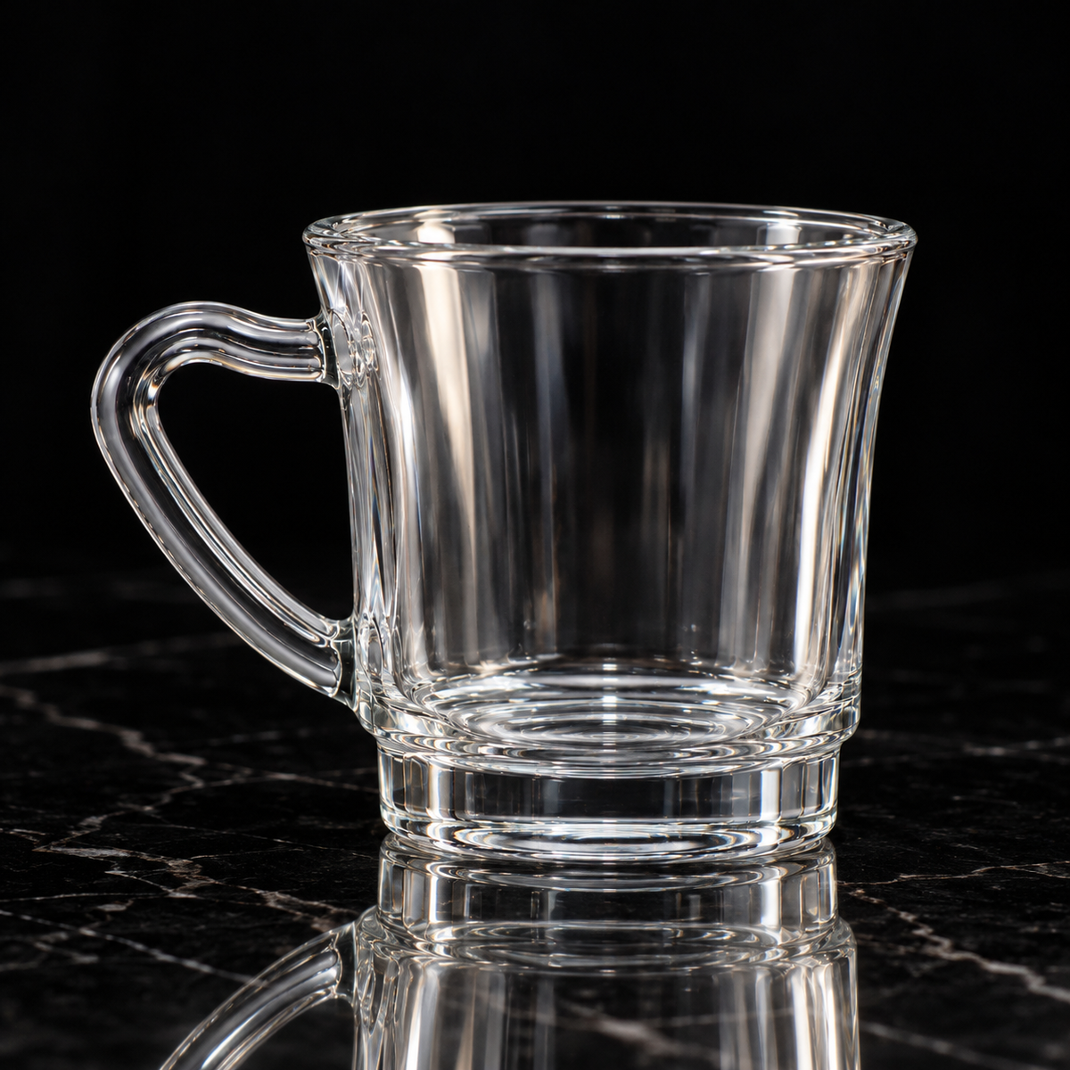 Clear glass mug on black marble