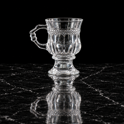 Footed crystal tea glass on black marble