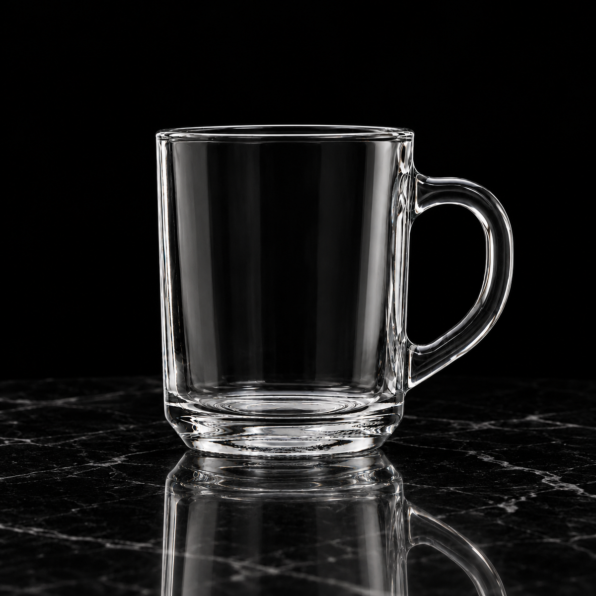 Clear glass mug on black marble