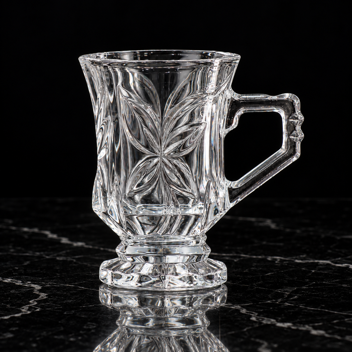 Crystal footed tea mug on black marble