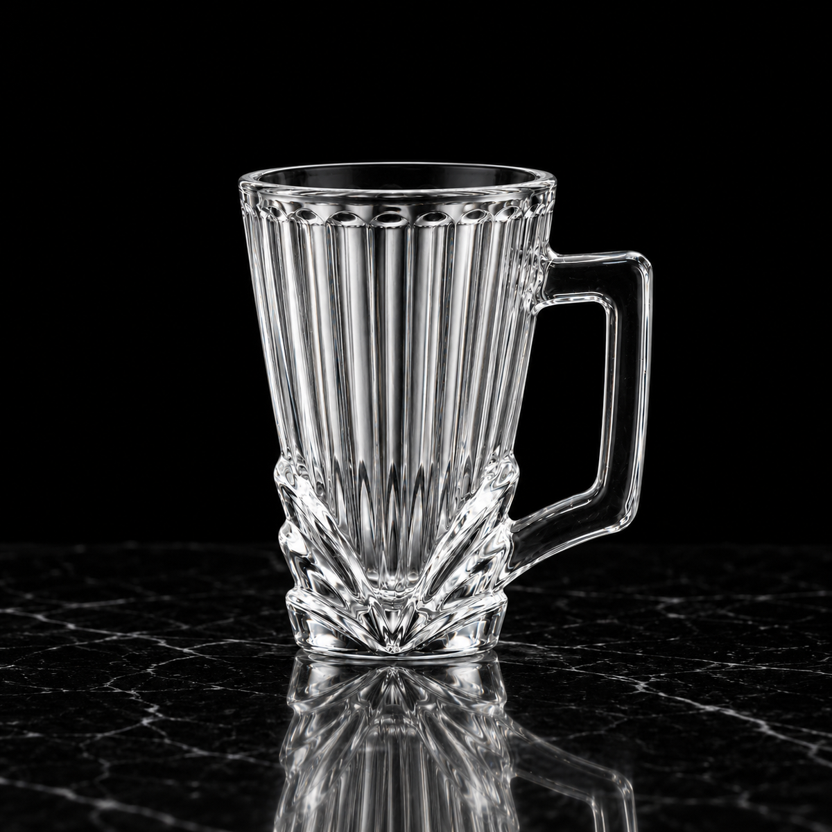 Ribbed glass cup on black marble