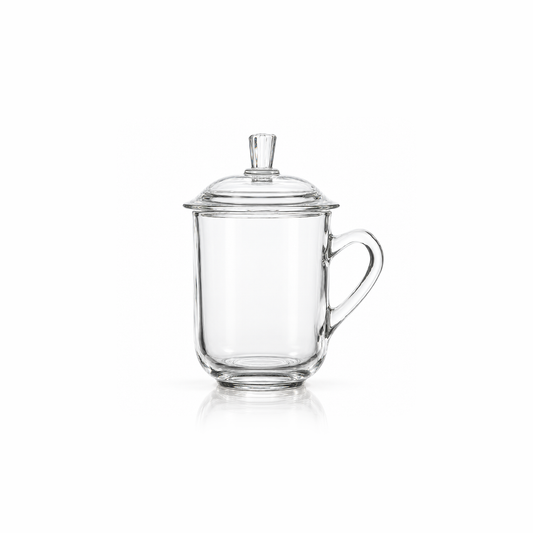 Clear glass tea mug with domed lid on white