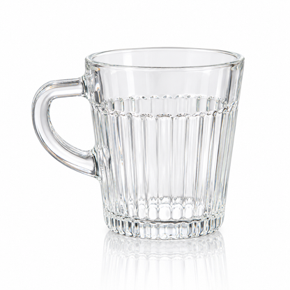 Fluted clear glass tea mug on white