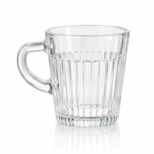 Fluted clear glass tea mug on white