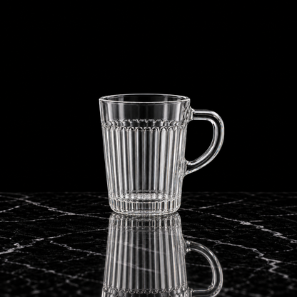 Fluted glass mug on black marble