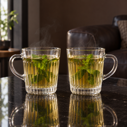 Two fluted glass mugs of mint tea in a living room