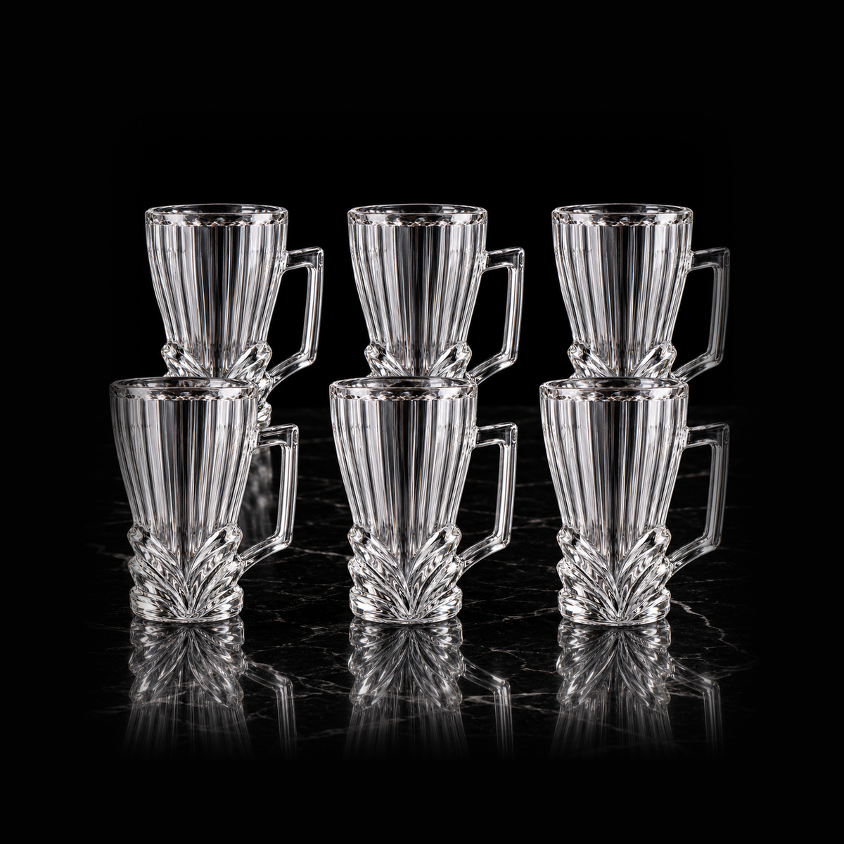 Leaf cut glass tea mugs on black marble