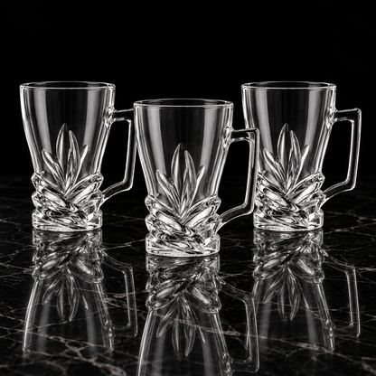 Leaf cut glass tea mugs on black marble