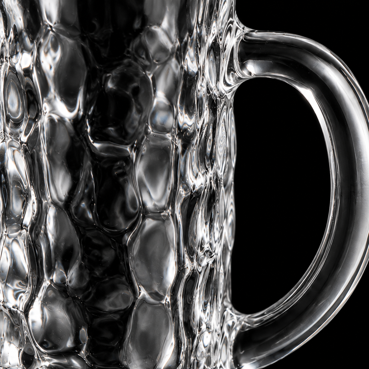 Hammered glass mug texture close-up