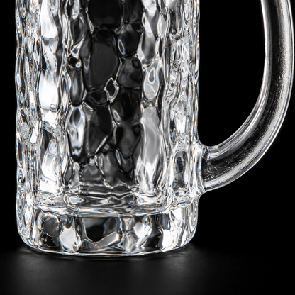 Tall hammered glass mug texture close-up