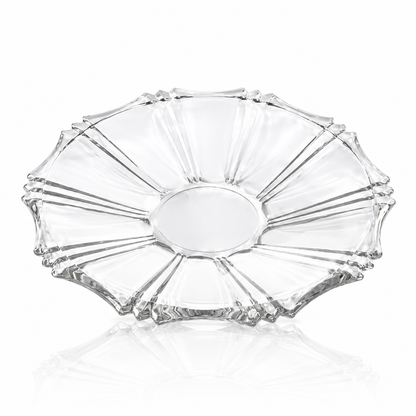 Clear glass serving plate on white marble