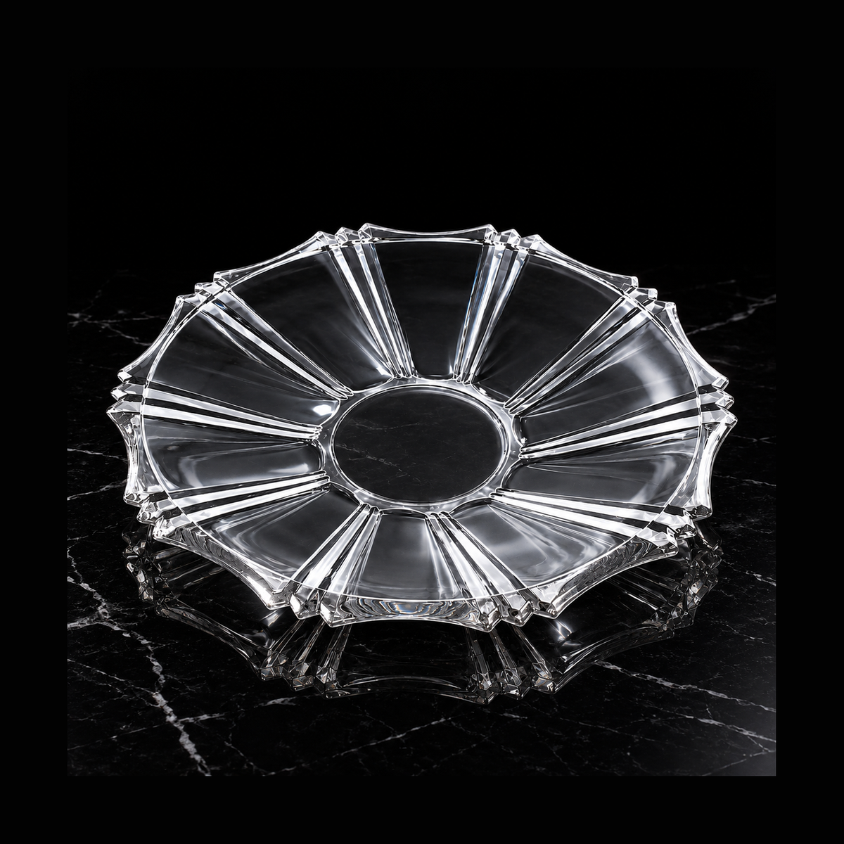 Clear glass serving plate on black marble