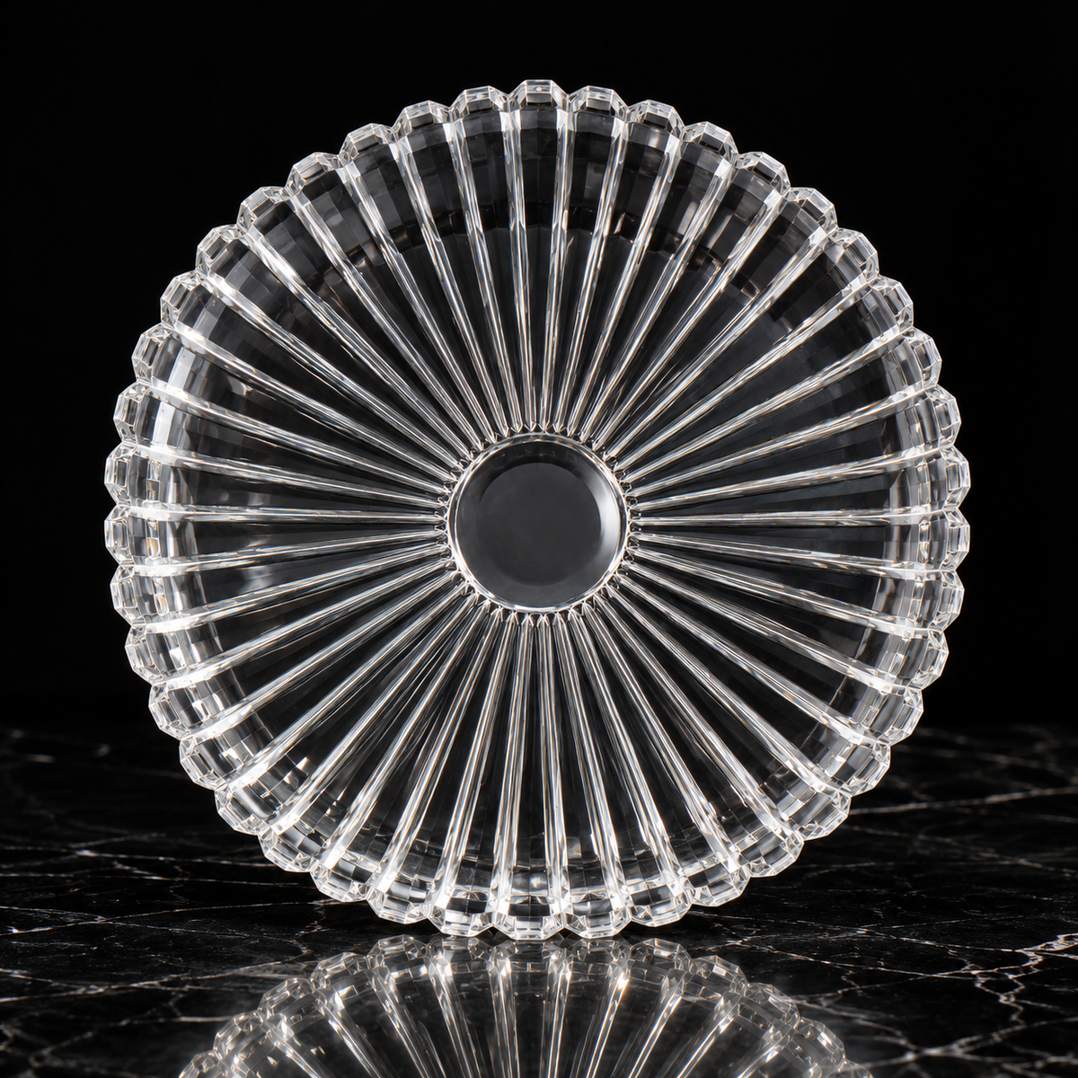 Crystal sunburst serving plate on black marble