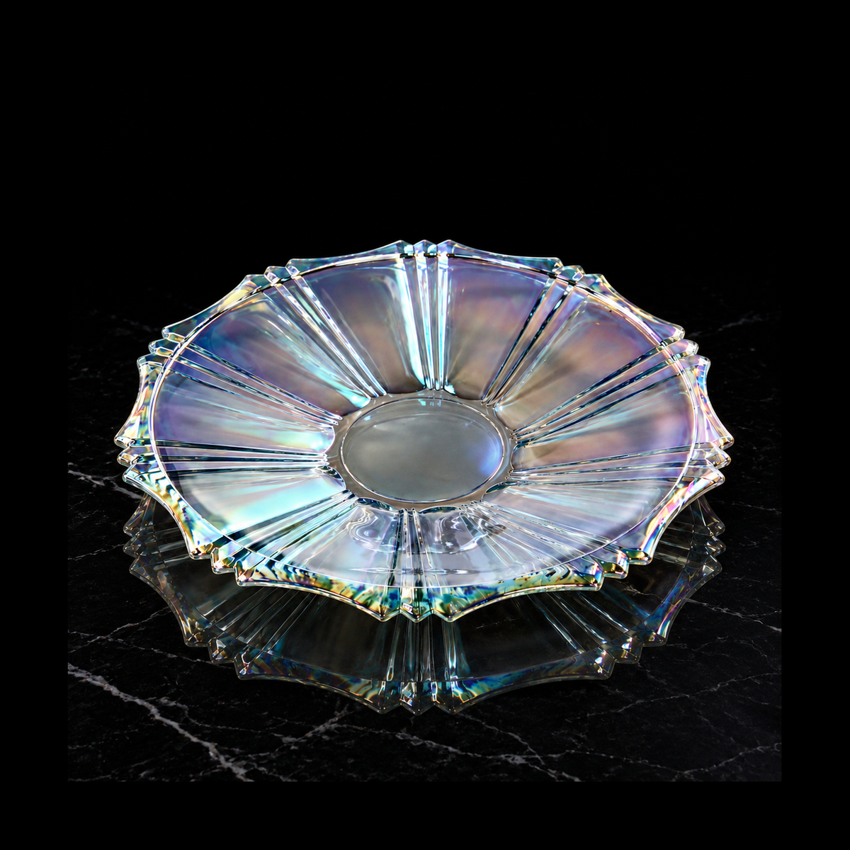 Iridescent serving plate on black marble