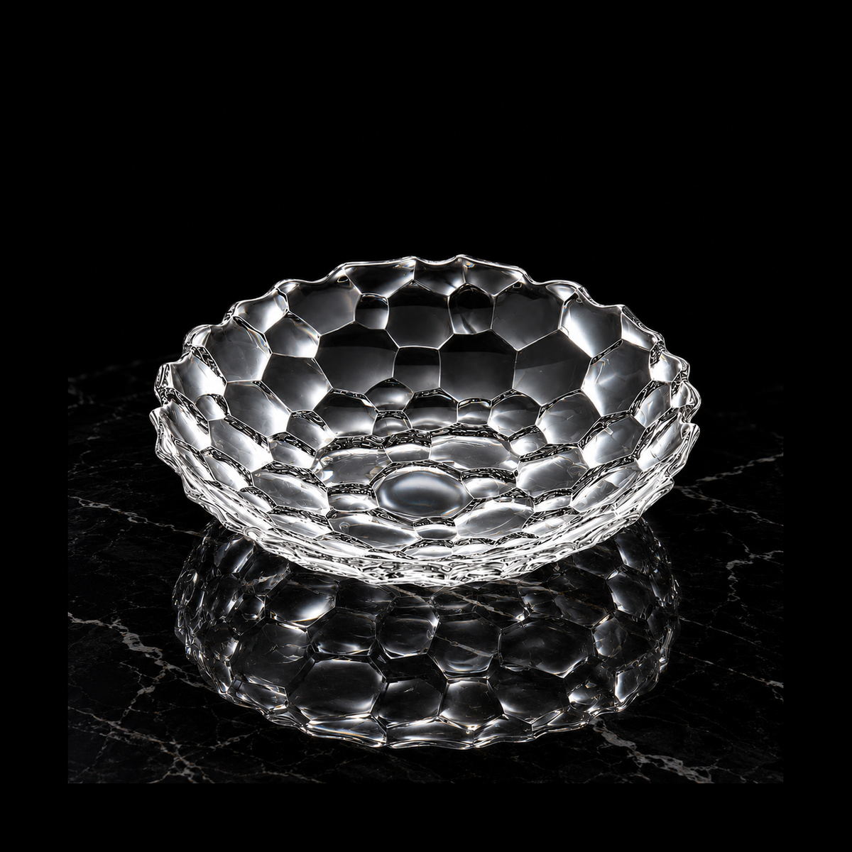 Crystal honeycomb plate on black marble
