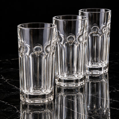 Fluted crystal highball glass on black marble