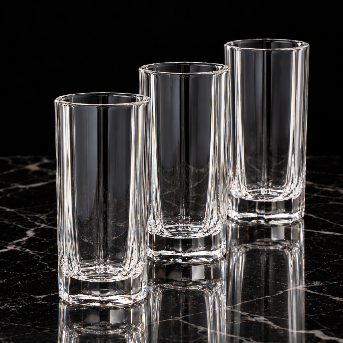 Octagonal glass highball tumbler on black marble
