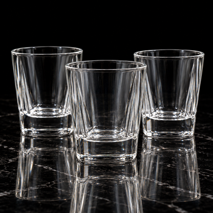 Faceted crystal lowball glass on black marble