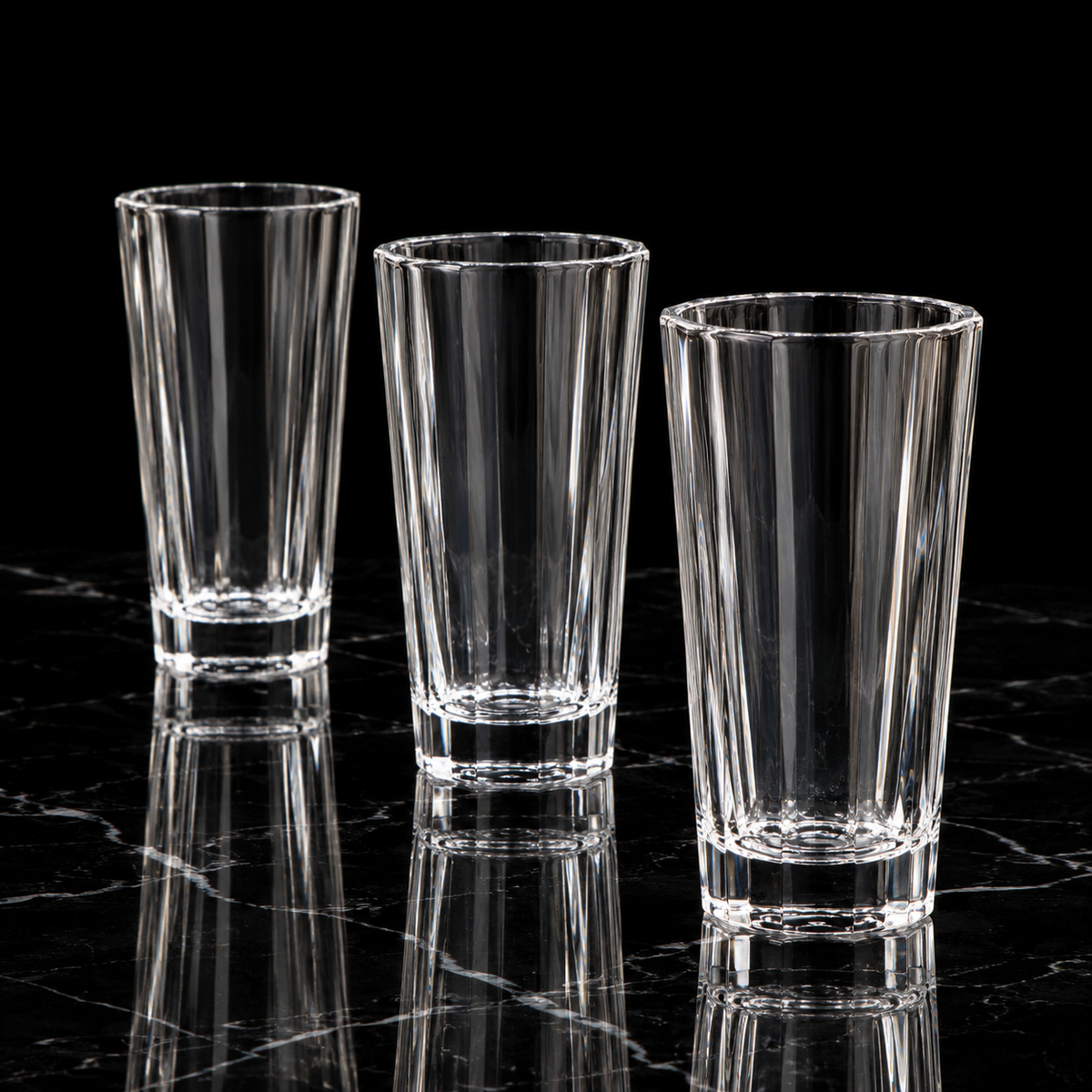 Faceted crystal tumbler on black marble